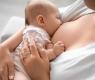 a woman breastfeeding her baby